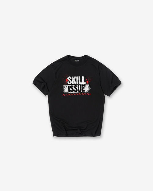 A Black short-sleeve crewneck t-shirt with a distressed graphic on the chest reading 'SKILL ISSUE' in white and red, displayed flat against a light gray background.
