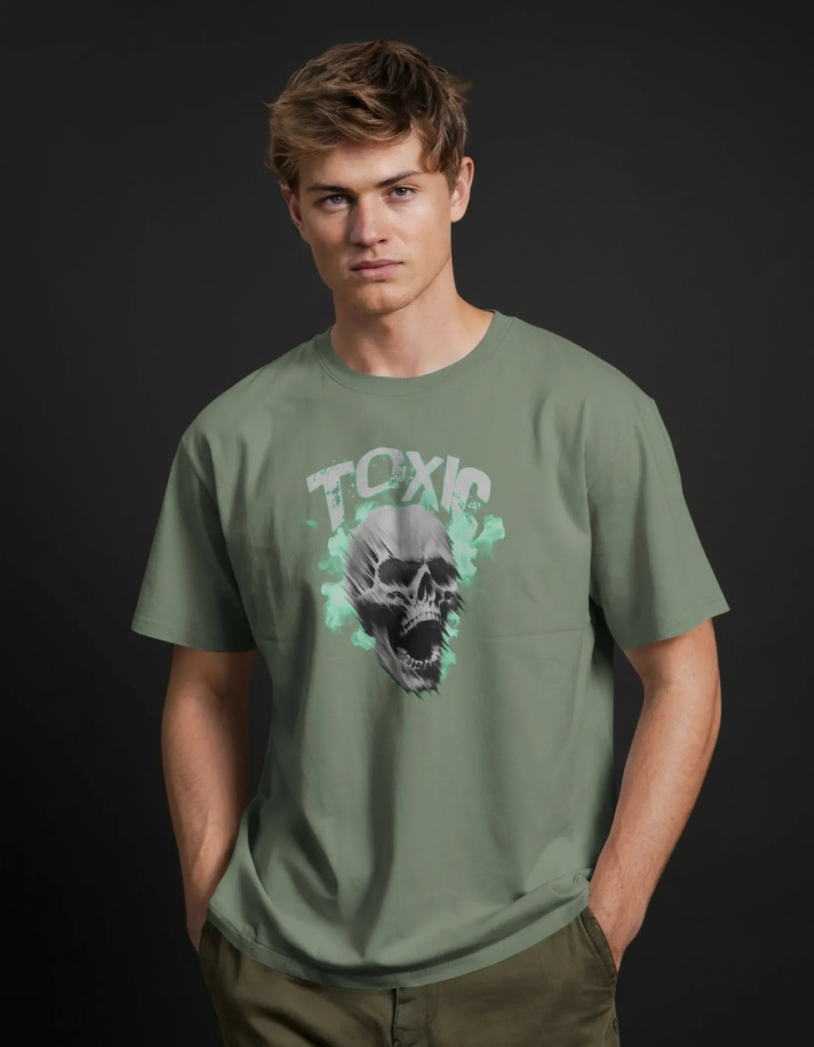 Person wearing a green t-shirt with a skull and 'TOXIC' graphic against an orange background